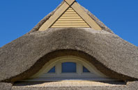 Scaling thatch roofing